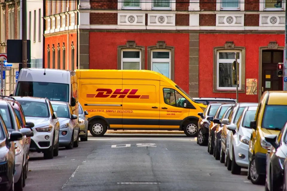 Parcel delivery vans parked along a city street